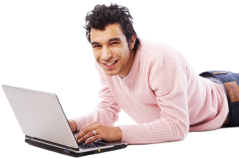 A smiling man enrolling for classes online